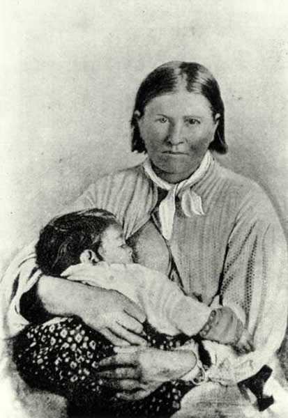 White woman nursing her Comanche baby