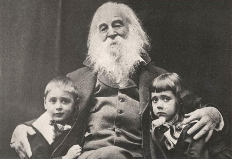 A photo of Walt Whitman with two children.