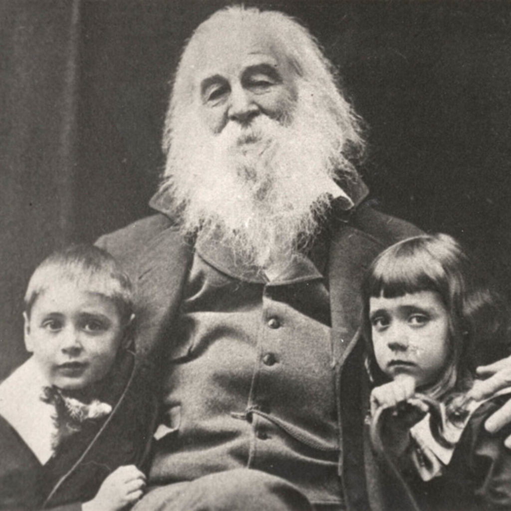 A photo of Walt Whitman with two children.